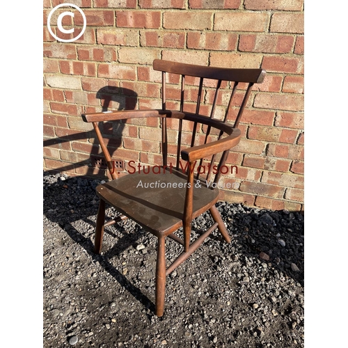 197 - An Ercol style stick back carver chair