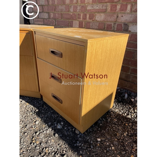 2 - A pair of mid century teak effect bedside chests of three