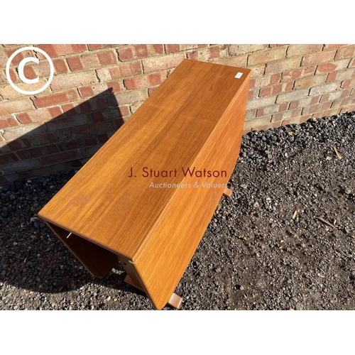 206 - A teak drop leaf dining table