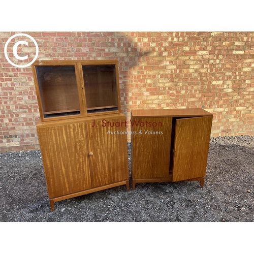 218 - A pair of mid century teak office cupboards, one having a glazed bookcase top