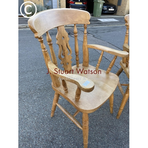 22 - A pair of waxed pine carver chairs