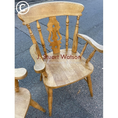 22 - A pair of waxed pine carver chairs