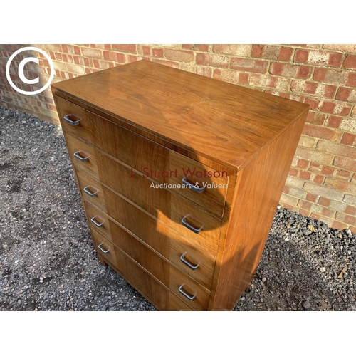 221 - A deco style walnut tallboy chest of five drawers with chrome handles