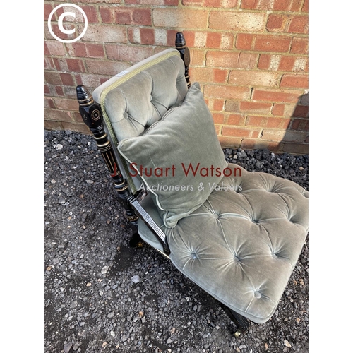 224 - A green upholstered ebonised salon chair