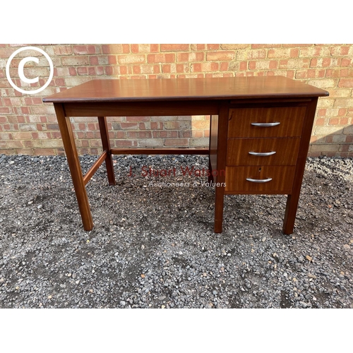 227 - A teak three drawer office desk