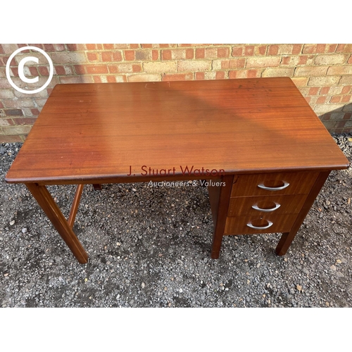 227 - A teak three drawer office desk