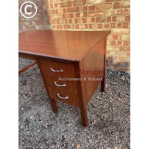 227 - A teak three drawer office desk