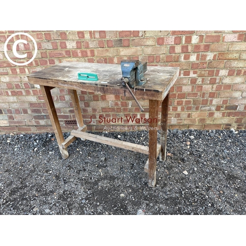 229 - A wooden workbench with vice