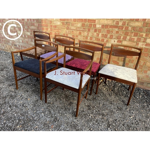 231 - A set of six Macintosh teak dining chairs including 2 carvers with crush velvet upholstered seats