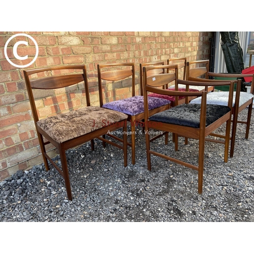 231 - A set of six Macintosh teak dining chairs including 2 carvers with crush velvet upholstered seats