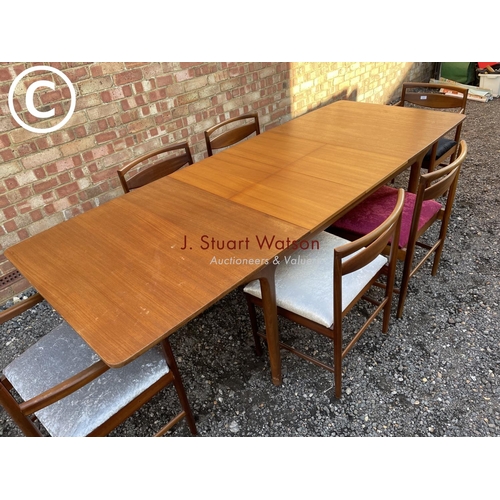 232 - A Macintosh teak two leaf rectangular extending dining table (chairs shown relate to previous lot)