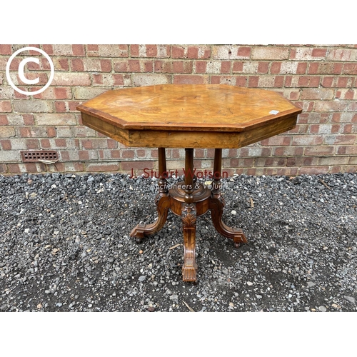 276 - An octagonal walnut occasional table