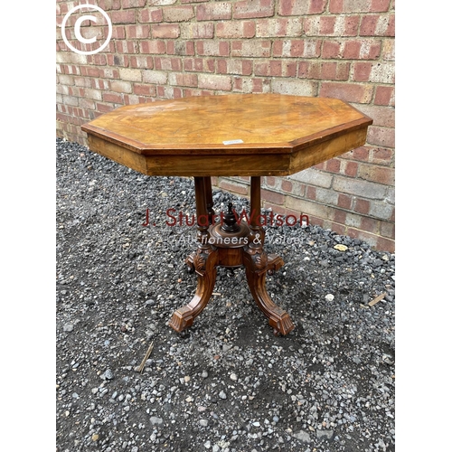 276 - An octagonal walnut occasional table