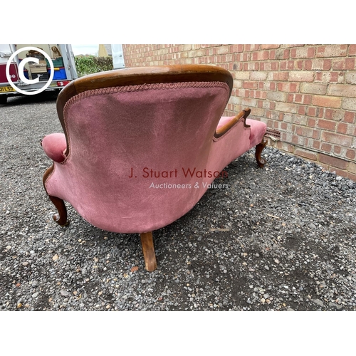 277 - A Victorian mahogany framed spoonback chaise lounge upholstered in pink (one foot AF but castors pre... 