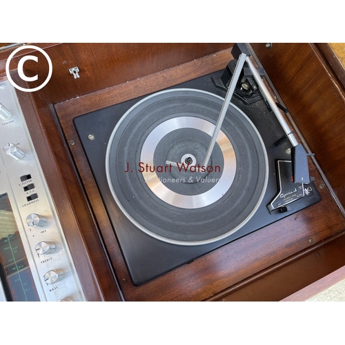 295 - A walnut cased dynatron record player with garrard deck, together with speakers