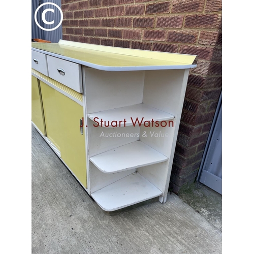 296 - A yellow and white  painted 1950's kitchen sideboard