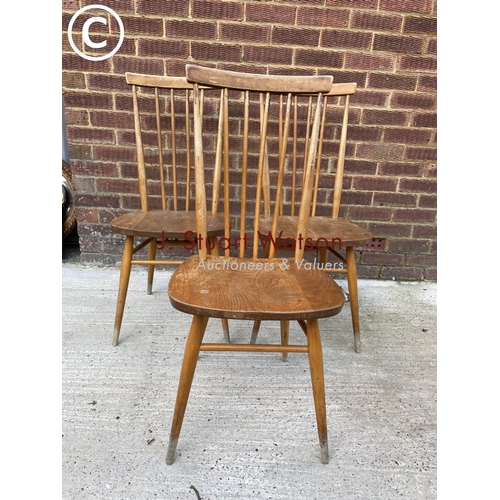 297 - A set of three Ercol stick back chairs