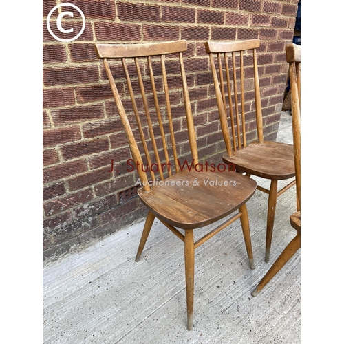 297 - A set of three Ercol stick back chairs