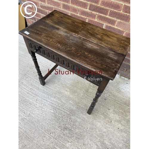 299 - A small reproduction oak single drawer table