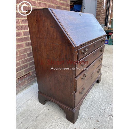 301 - An early Victorian mahogany bureau with a fitted interior