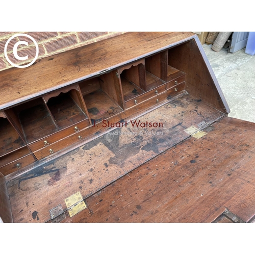 301 - An early Victorian mahogany bureau with a fitted interior