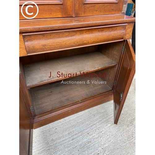 304 - A Victorian Mahogany glazed bookcase cupboard with a single drawer and adjustable shelves