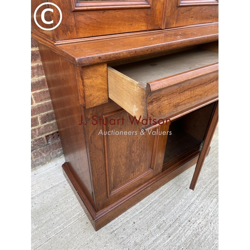 304 - A Victorian Mahogany glazed bookcase cupboard with a single drawer and adjustable shelves