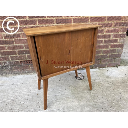 309 - A mid century teak record cupboard