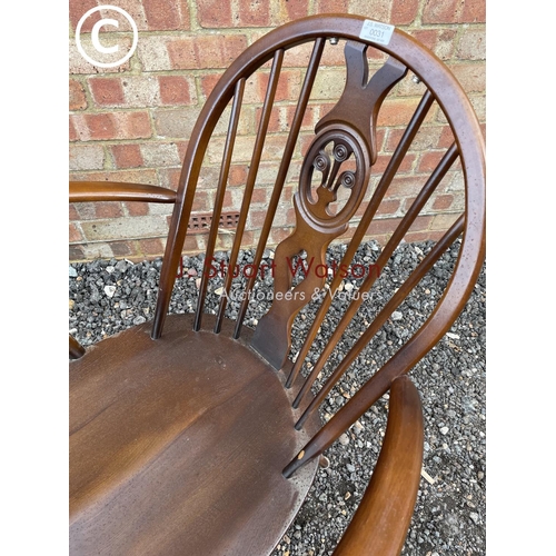 31 - A dark Ercol armchair