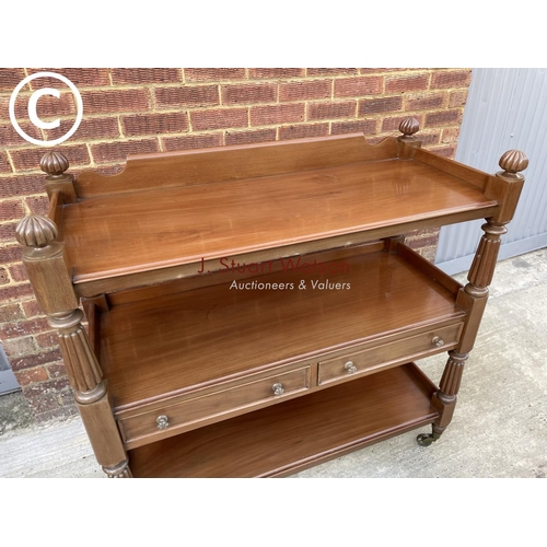 312 - A Victorian mahogany three tier buffet with two drawers