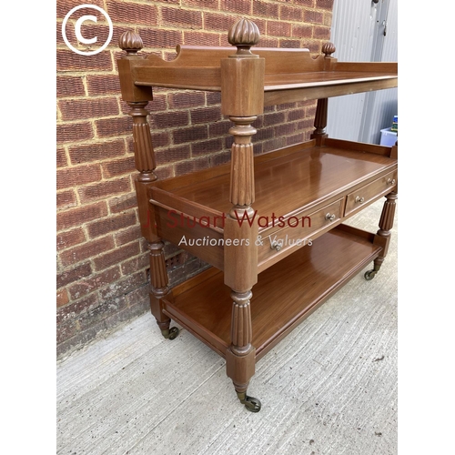 312 - A Victorian mahogany three tier buffet with two drawers