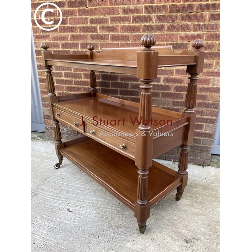 312 - A Victorian mahogany three tier buffet with two drawers