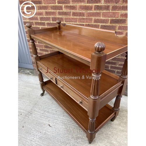 312 - A Victorian mahogany three tier buffet with two drawers