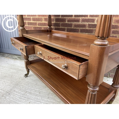 312 - A Victorian mahogany three tier buffet with two drawers