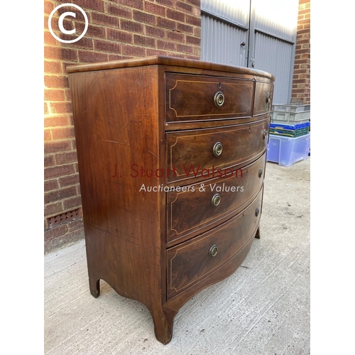 317 - A Victorian mahogany bow front chest of five drawers