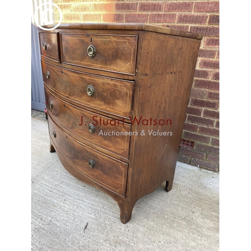 317 - A Victorian mahogany bow front chest of five drawers