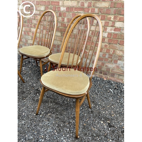 32 - A set of four Ercol golden dawn stick back chairs