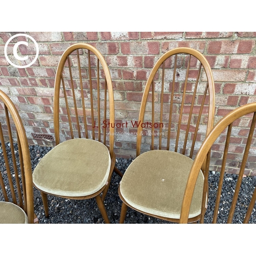 32 - A set of four Ercol golden dawn stick back chairs