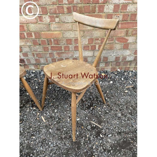 33 - A pair of Ercol stacking chairs