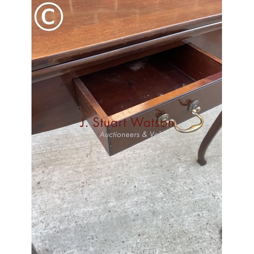 331 - A mahogany fold over card table with a single drawer