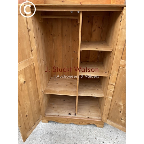 336 - A solid pine nursery wardrobe