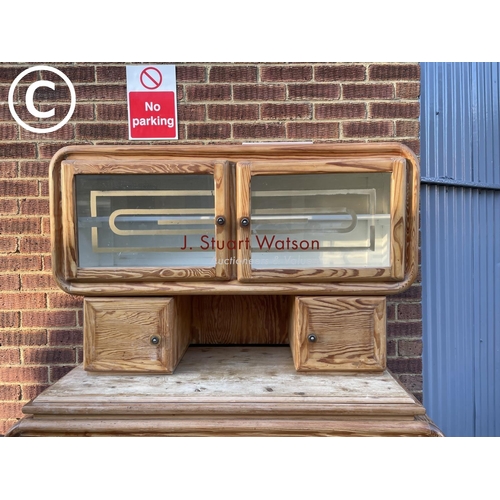 341 - An unusual Dutch pine kitchen cabinet glazed top with fitted coffee grinder over two, drawer and two... 