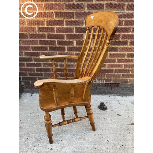 344 - A country pine Windsor carver chair