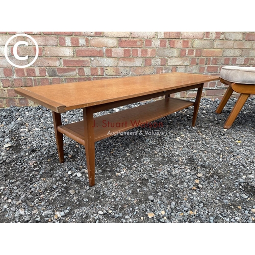 35 - A mid century teak coffee tabke by Myer together with a teak framed stool