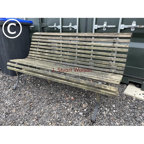 361 - A scrollwork metal frame garden bench with wooden slatted seat