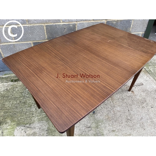 383 - Mcintosh style rectangular teak dining tabke with one extension leaf