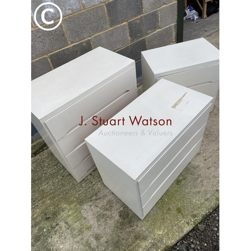 386 - Three white painted ply chests of drawers