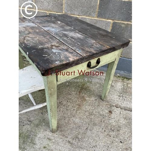 390 - A vintage pine part painted kitchen table with a single drawer, together with a painted Windsor chai... 