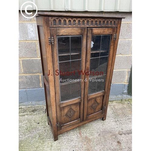 398 - A reproduction glazed oak bookcase