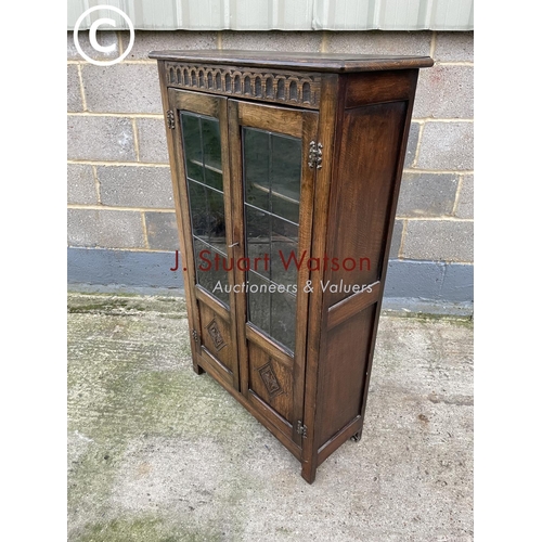 398 - A reproduction glazed oak bookcase